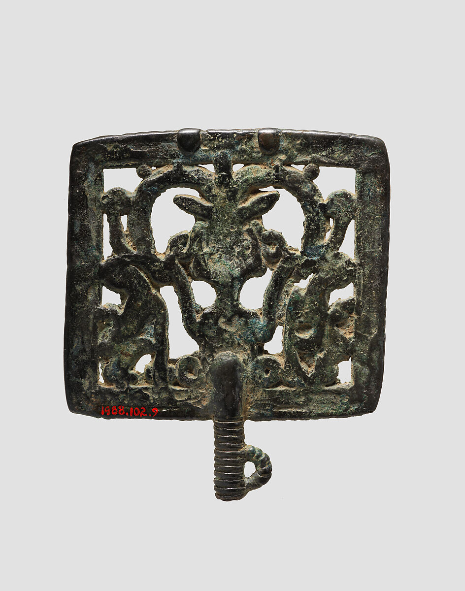 Head of a pin: horned demon holding inverted lions, Bronze, Iran
