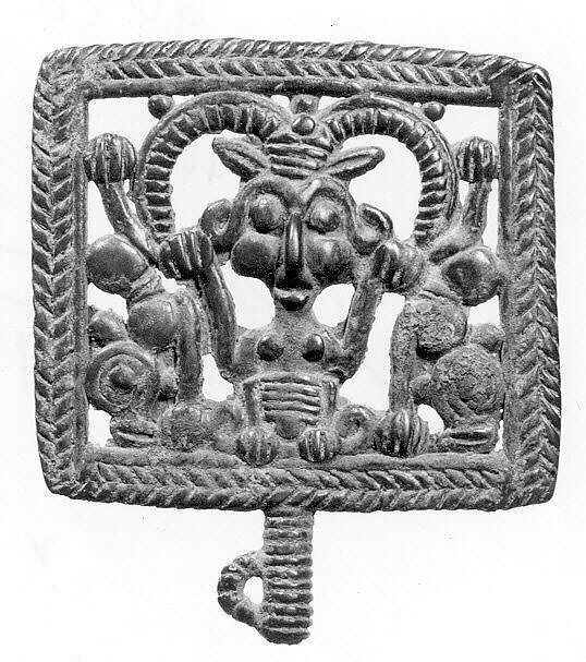 Head of a pin: horned demon holding inverted lions, Bronze, Iran 
