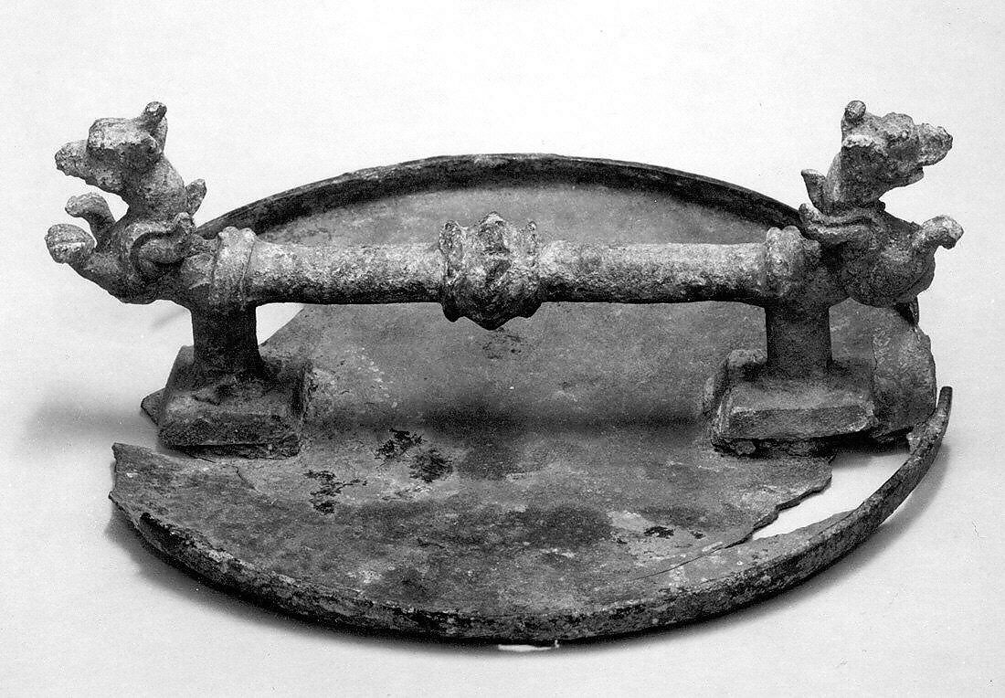 Mirror with a handle terminating in griffins, Bronze, Parthian or Sasanian 