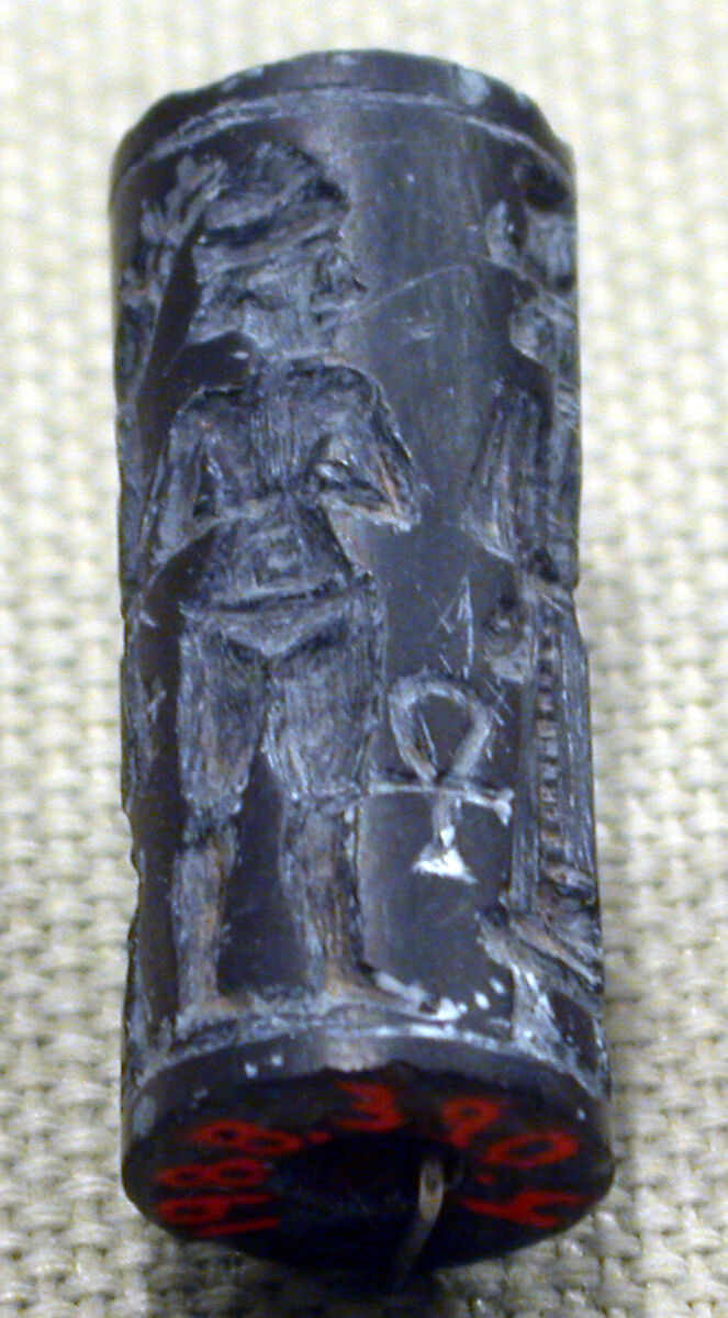 Cylinder seal and modern impression: smiting weather god before a Syrian goddess, nude goddess; ankh symbols, Hematite