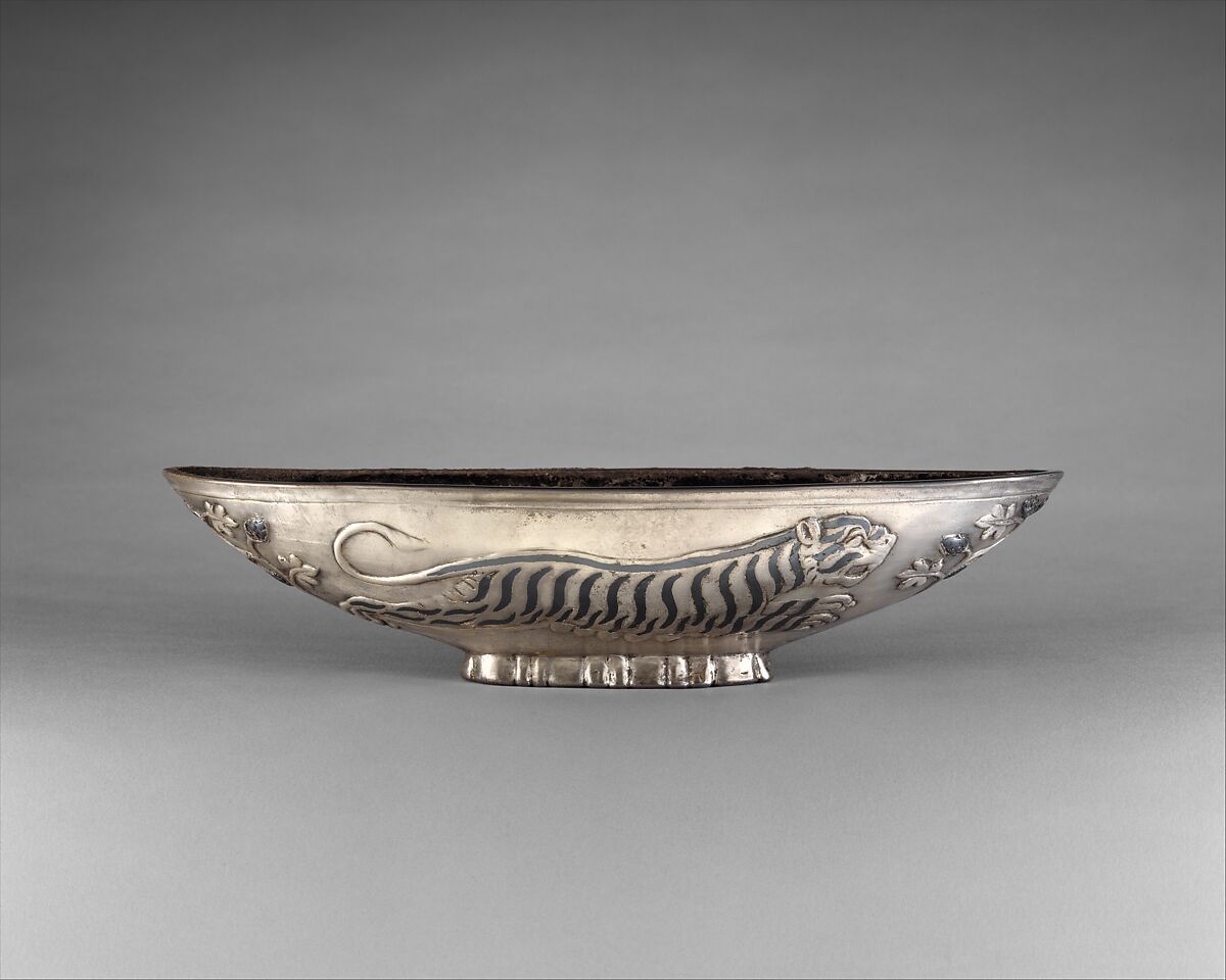 Oval bowl with running tigresses on each side, Silver, niello inlay, Sasanian