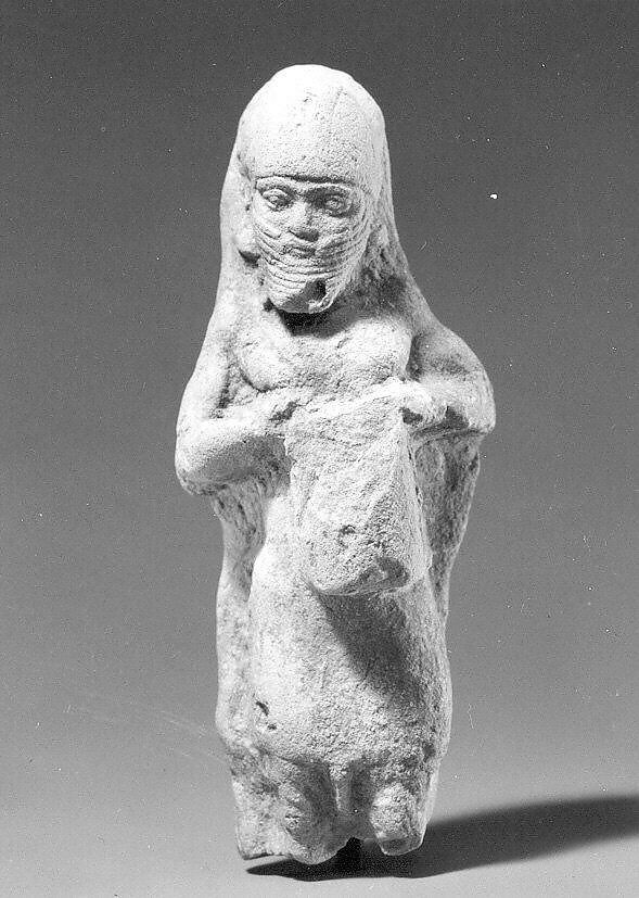 Figurine plaque: bearded man playing a drum, Ceramic, Babylonian 