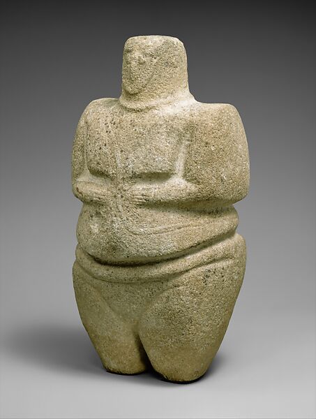 Standing female figure wearing a strap and a necklace, Sandstone, quartzite 