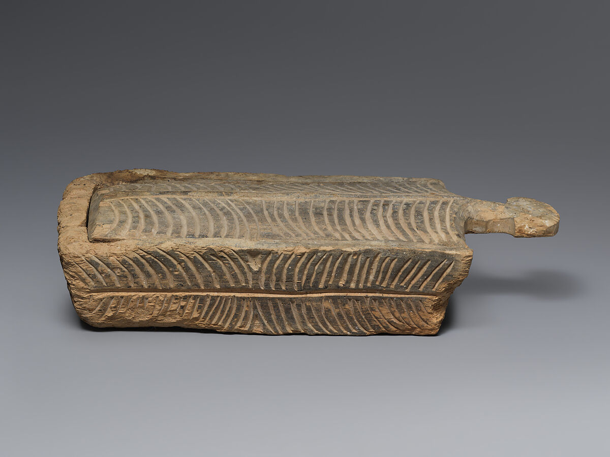 Rectangular wooden cosmetic or amulet box with sliding lid, Wood (poplar?), Alanic