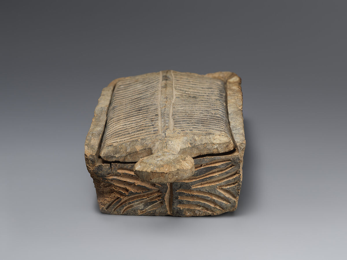 Rectangular wooden cosmetic or amulet box with sliding lid, Wood (poplar?), Alanic