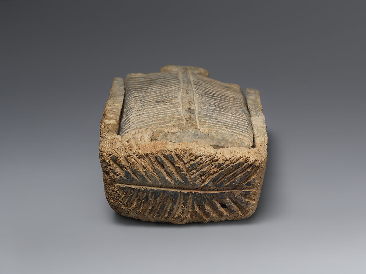 Rectangular wooden cosmetic or amulet box with sliding lid, Wood (poplar?), Alanic