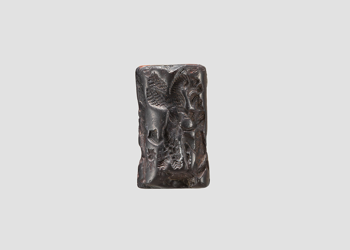 Cylinder seal and modern impression: heroes and animals in combat, head of the monster Humbaba, Hematite, Babylonian