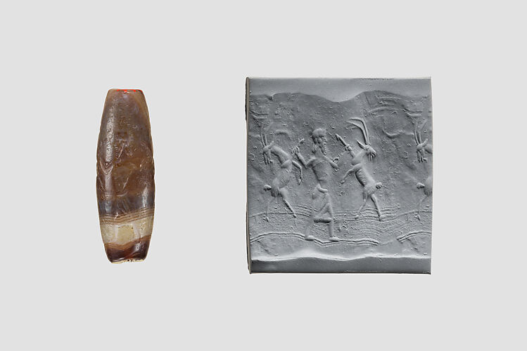 Cylinder seal with three-figure contest scene
