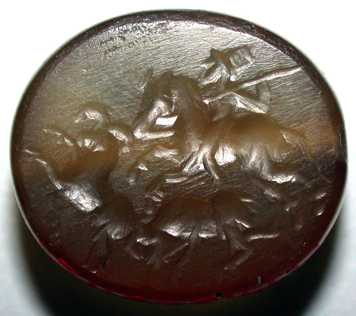 Stamp seal and modern impression: hunter on horse attacking rams, Chalcedony, Graeco-Bactrian 