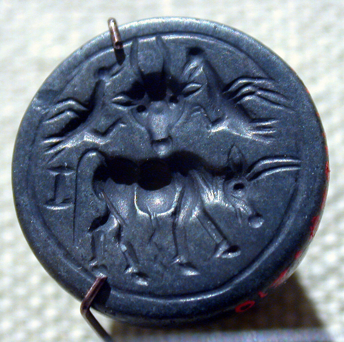 Stamp seal: bull, bucranium, and birds, Hematite, Cypriot 