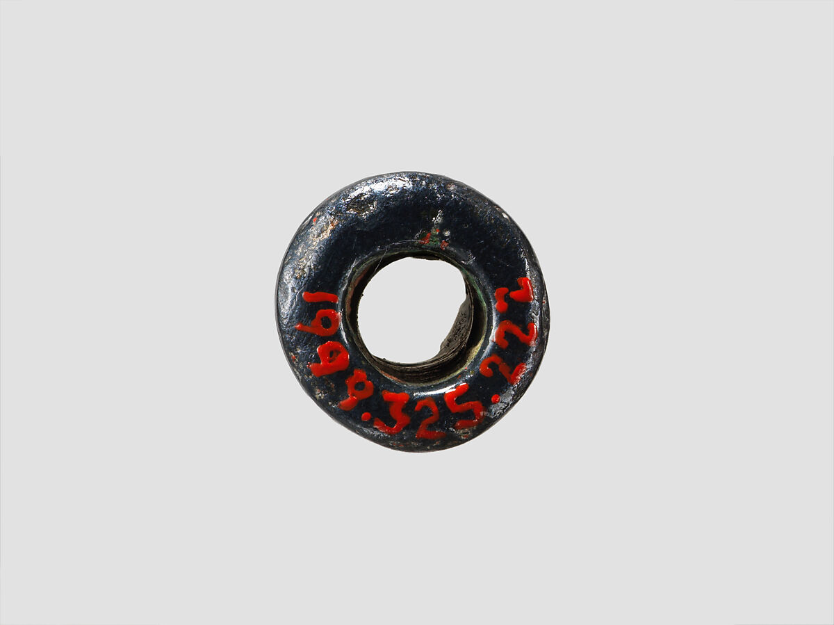 Cylinder seal and modern impression: palmette tree flanked by winged griffin and caprid; figure between them with raised hands; ingot, Hematite, Cypriot