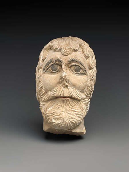 Head of a bearded god, Limestone, plaster and paint 