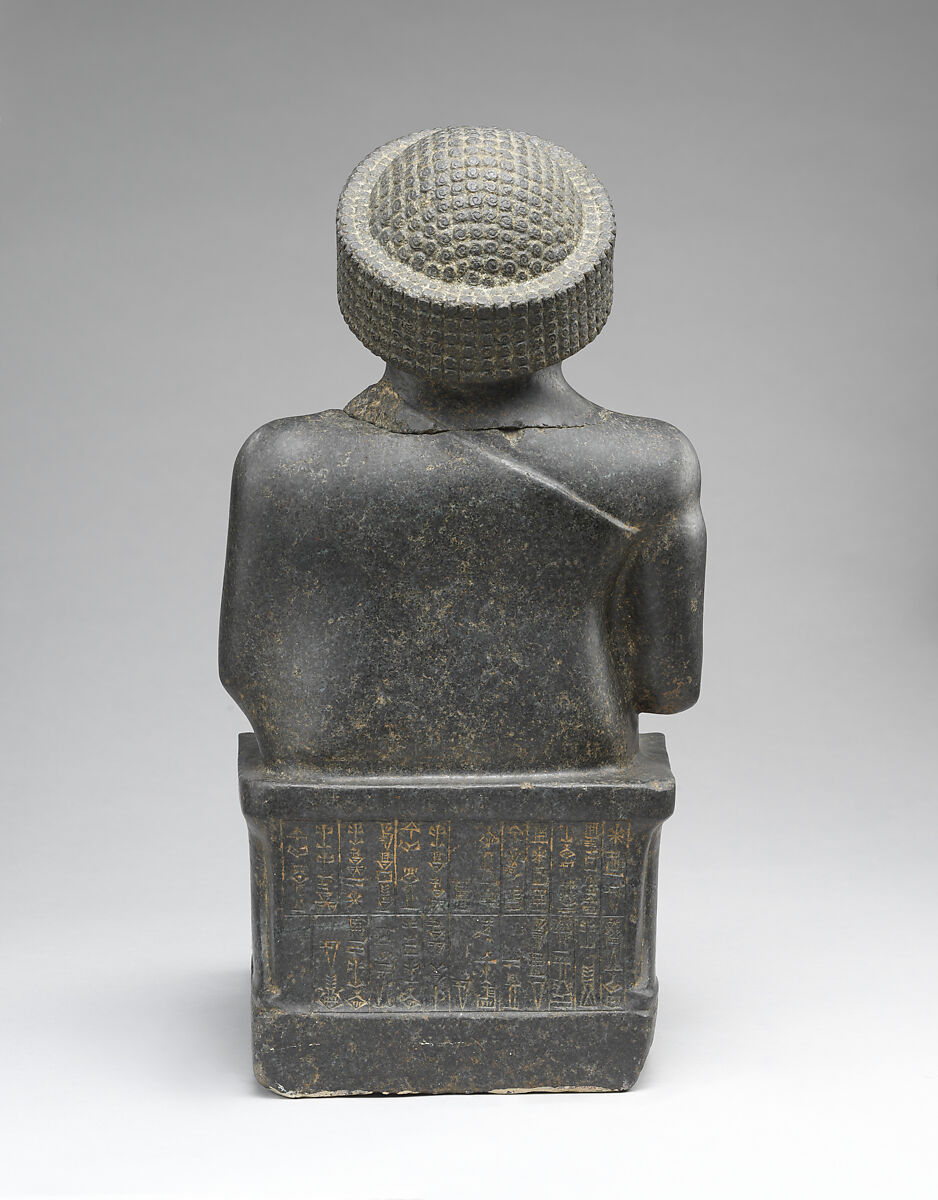Statue of Gudea, named “Gudea, the man who built the temple, may his life be long”, Diorite, Neo-Sumerian