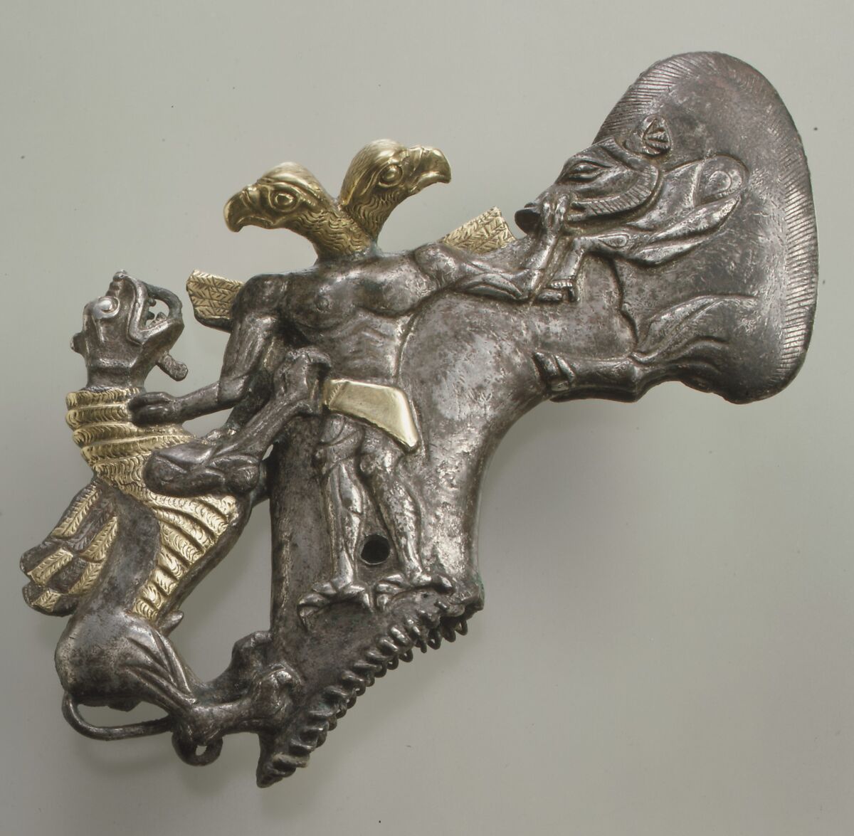 Shaft-hole axe head with bird-headed demon, boar, and dragon