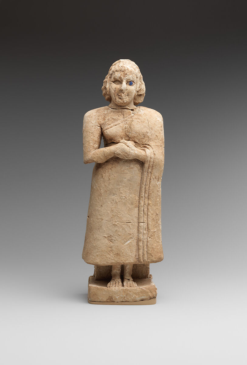 Standing female worshiper, Limestone, inlaid with shell and lapis lazuli, Sumerian 