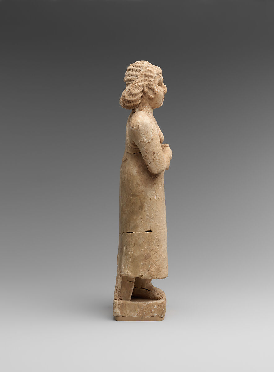Standing female worshiper, Limestone, inlaid with shell and lapis lazuli, Sumerian