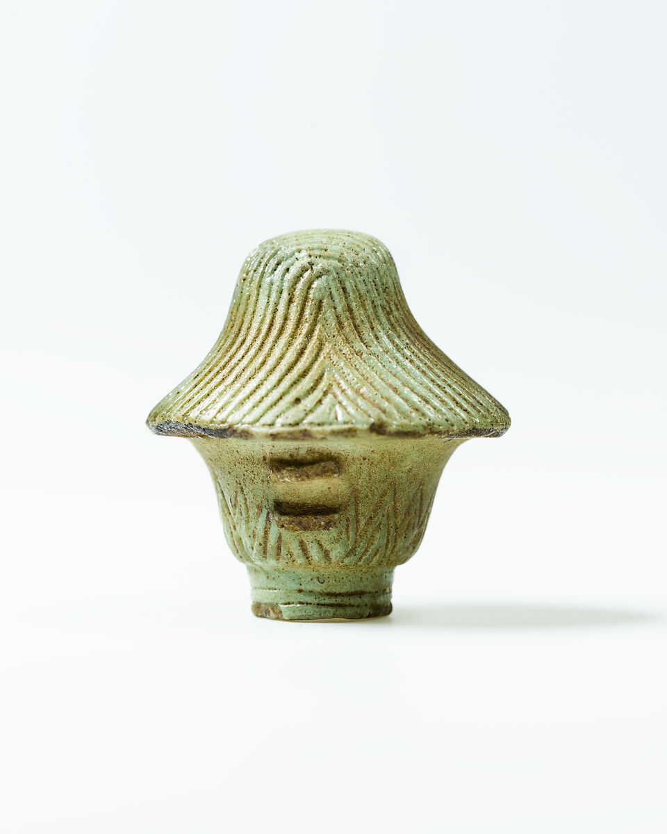 Top of papyrus scepter amulet with falcon head, Faience