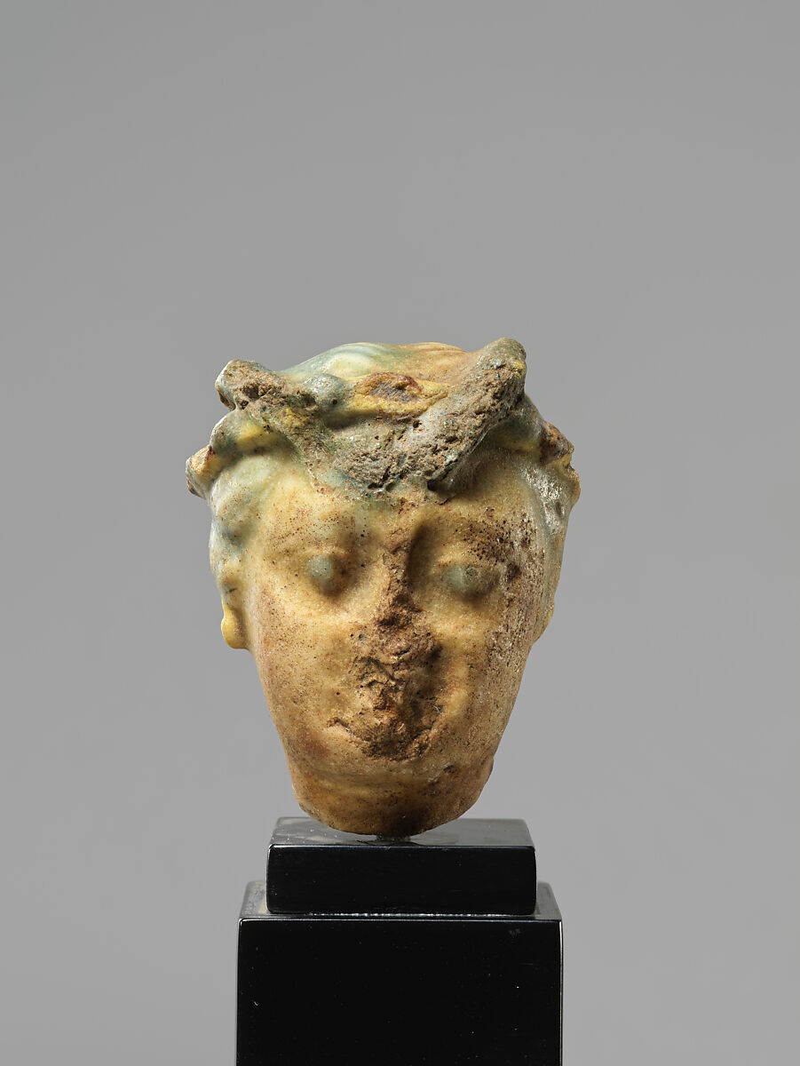 Head of a Ptolemaic Queen, Possibly Berenike II, Green and yellow faience 