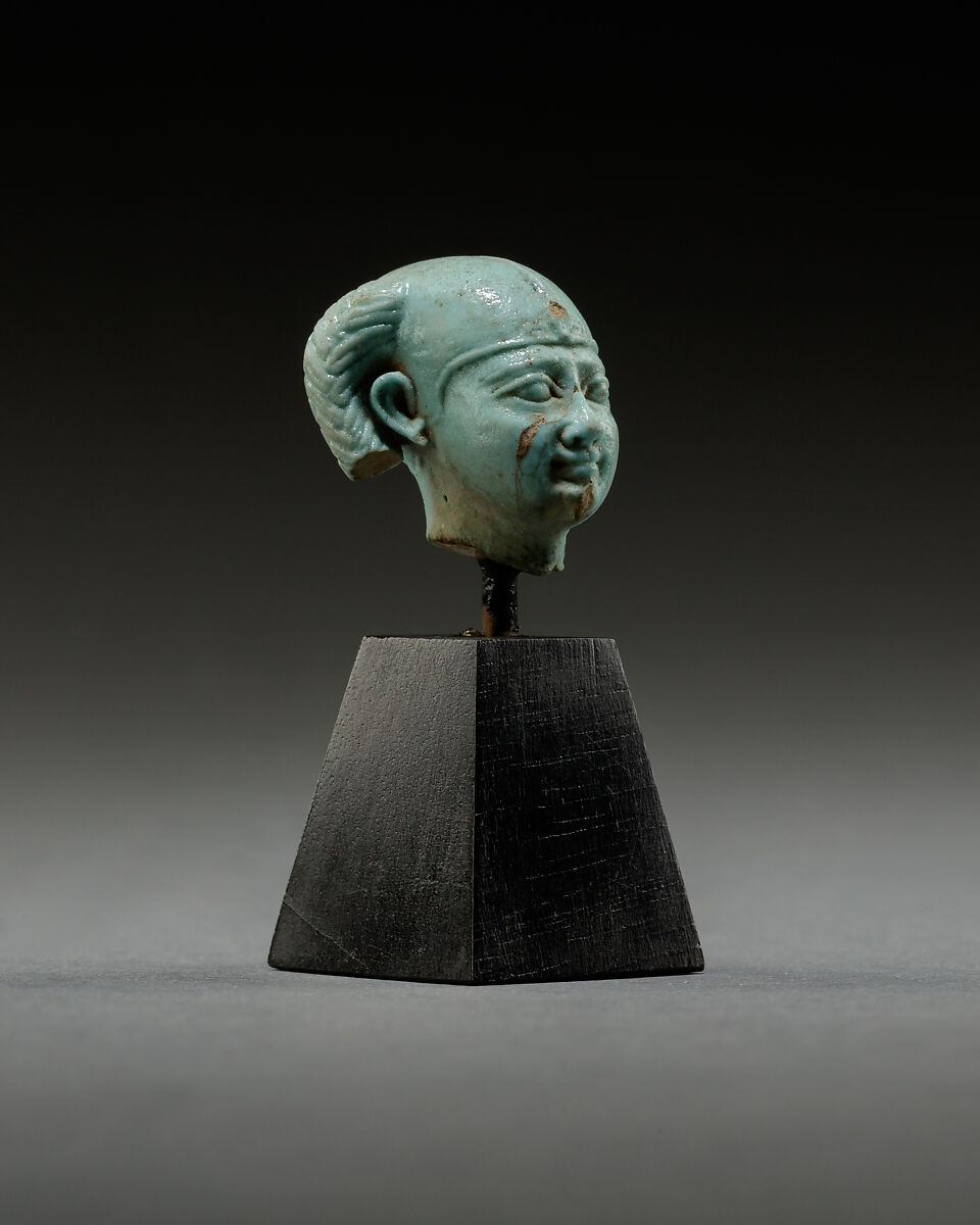 Head from a figure of a child god, perhaps Harpokrates, Faience