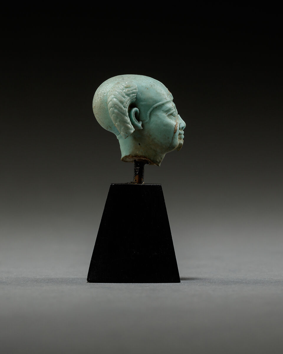 Head from a figure of a child god, perhaps Harpokrates, Faience