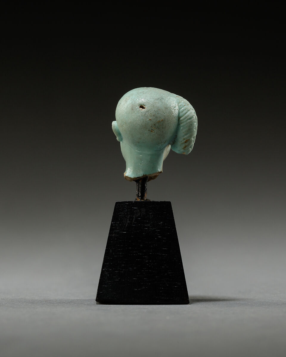 Head from a figure of a child god, perhaps Harpokrates, Faience