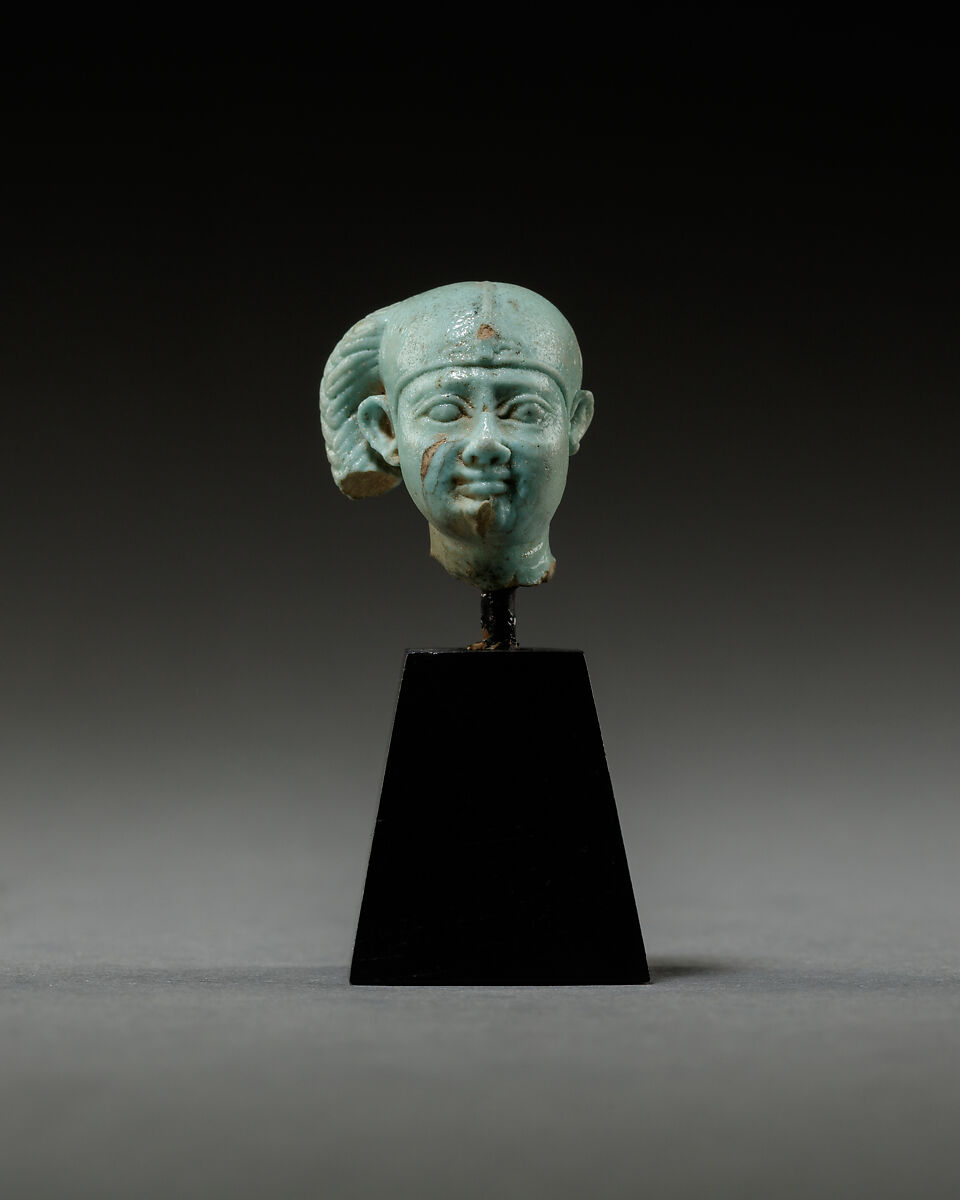 Head from a figure of a child god, perhaps Harpokrates, Faience 