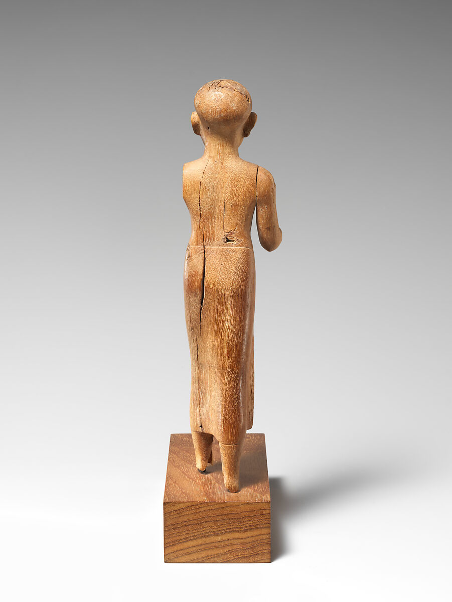 Figure of a Striding Man with a Long Kilt, Wood