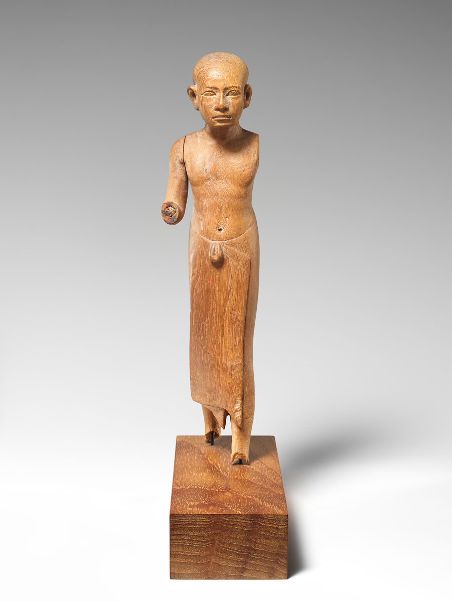 Figure of a Striding Man with a Long Kilt, Wood