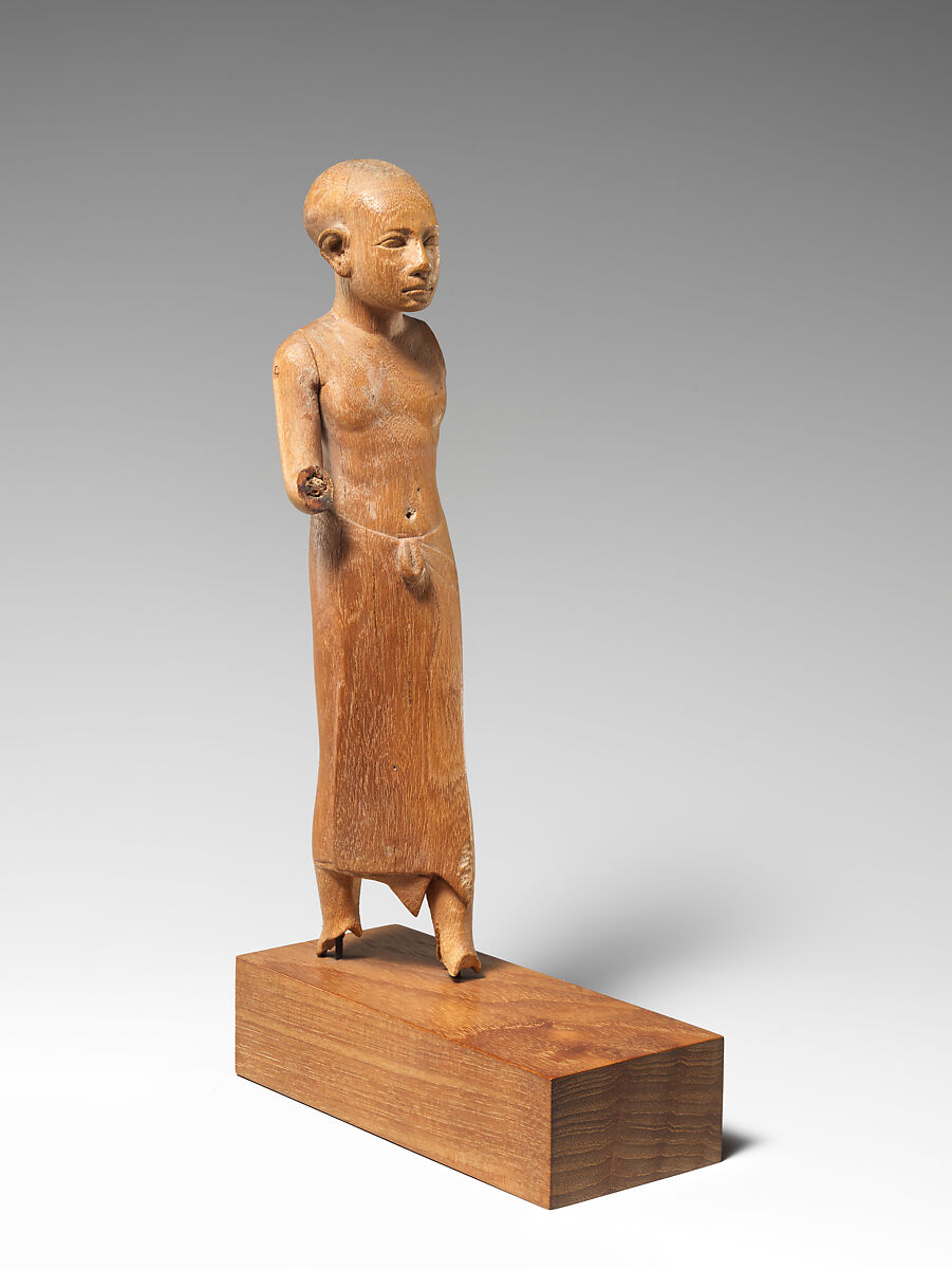 Figure of a Striding Man with a Long Kilt, Wood