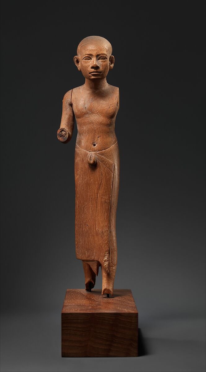 Figure of a Striding Man with a Long Kilt, Wood