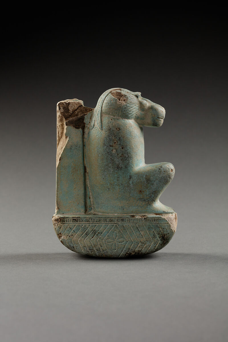Figure of baboon on a basket and with a pillar, the shebet offering, Faience