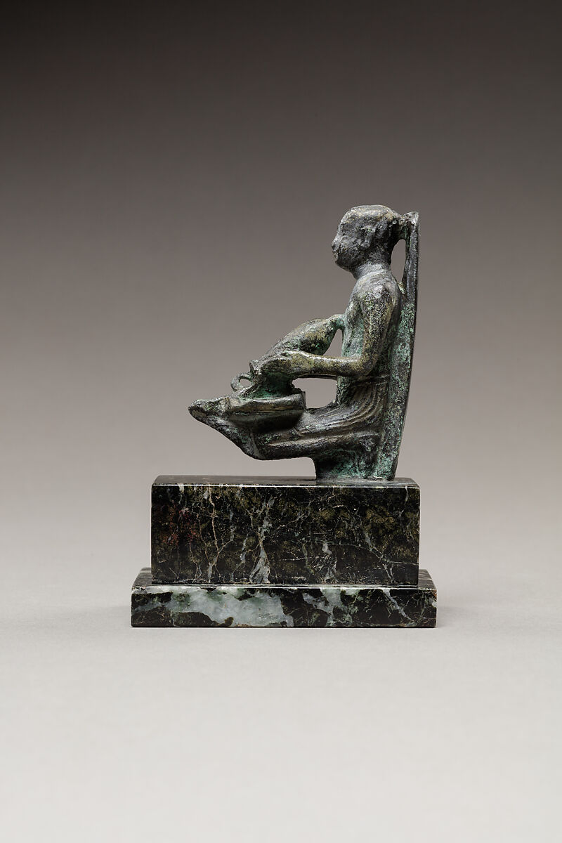 Pediese kneeling and pouring libation, Copper alloy