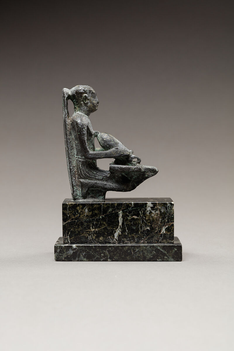 Pediese kneeling and pouring libation, Copper alloy