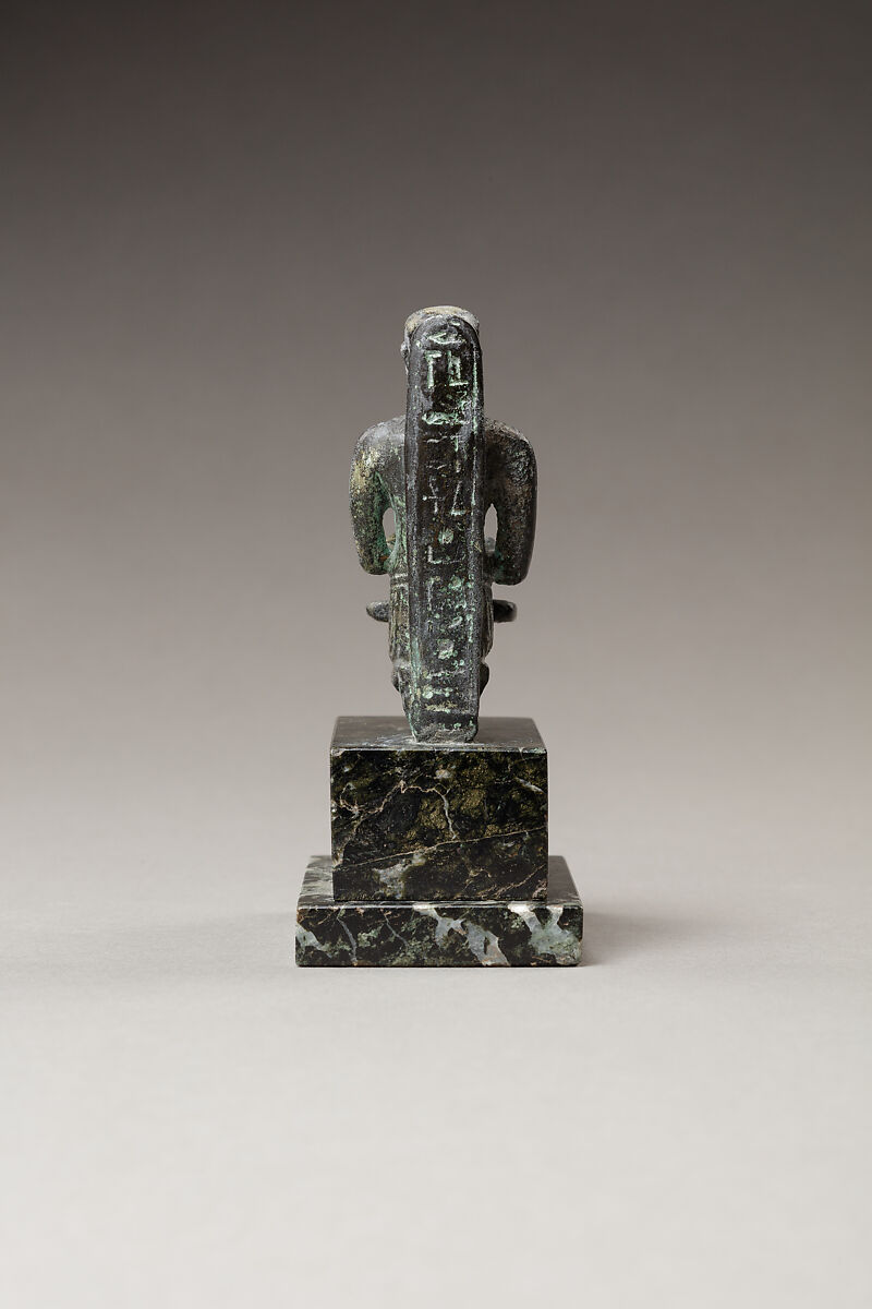 Pediese kneeling and pouring libation, Copper alloy