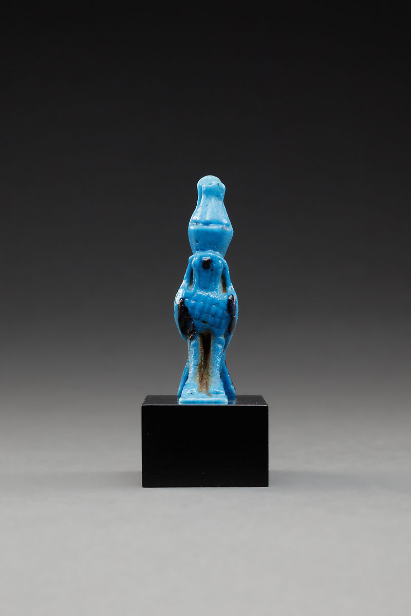 Horus amulet in the shape of a falcon with the double crown, Faience