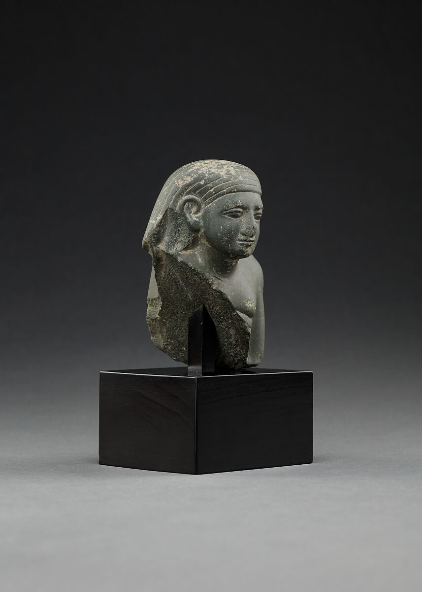 Upper part of a male seated figure, Fine-grained grey stone (graywacke?)