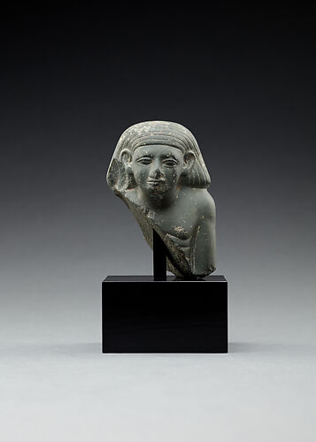 Upper part of a male seated figure