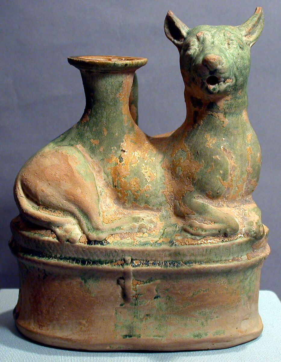 Terracotta askos in the shape of a reclining dog, Glazed terracotta (green and yellow), Roman 
