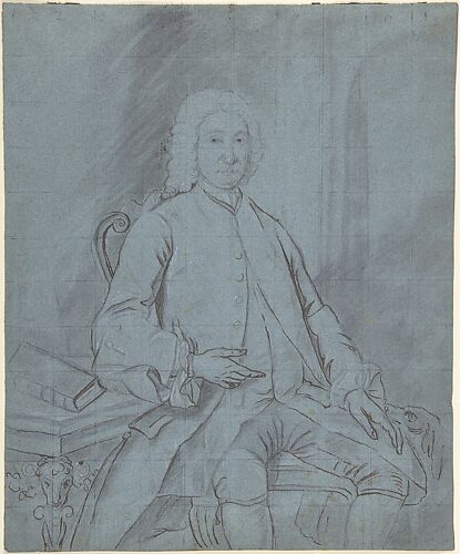 Three-quarter length portrait study of a man seated at a desk with a dog