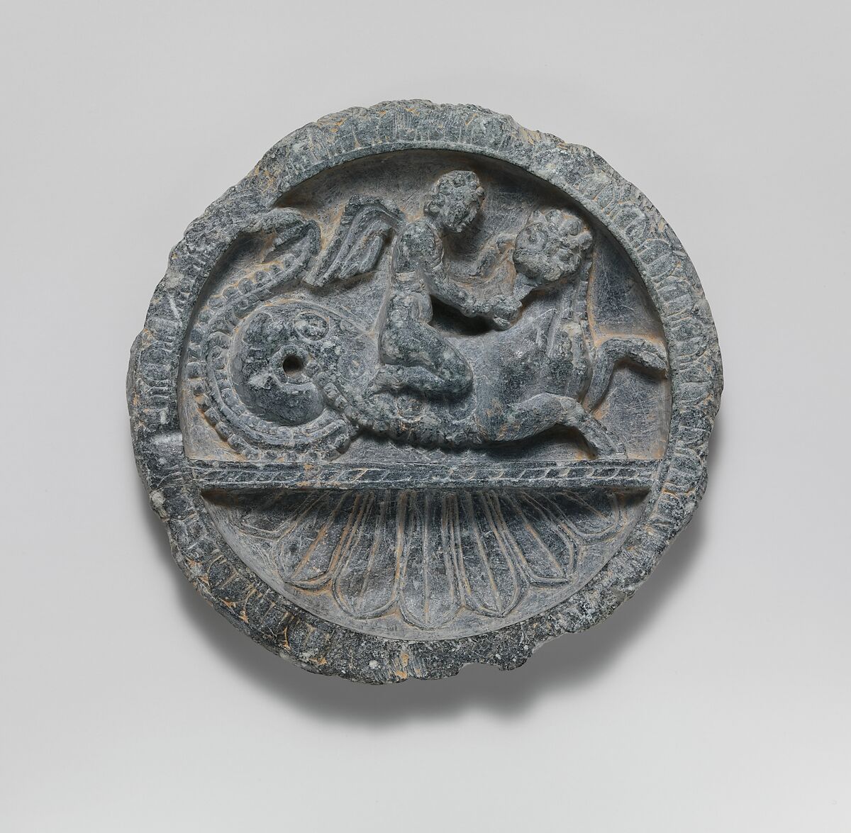 Dish with Winged Eros Riding a Lion-Headed Sea Monster, Schist, Pakistan (ancient region of Gandhara) 