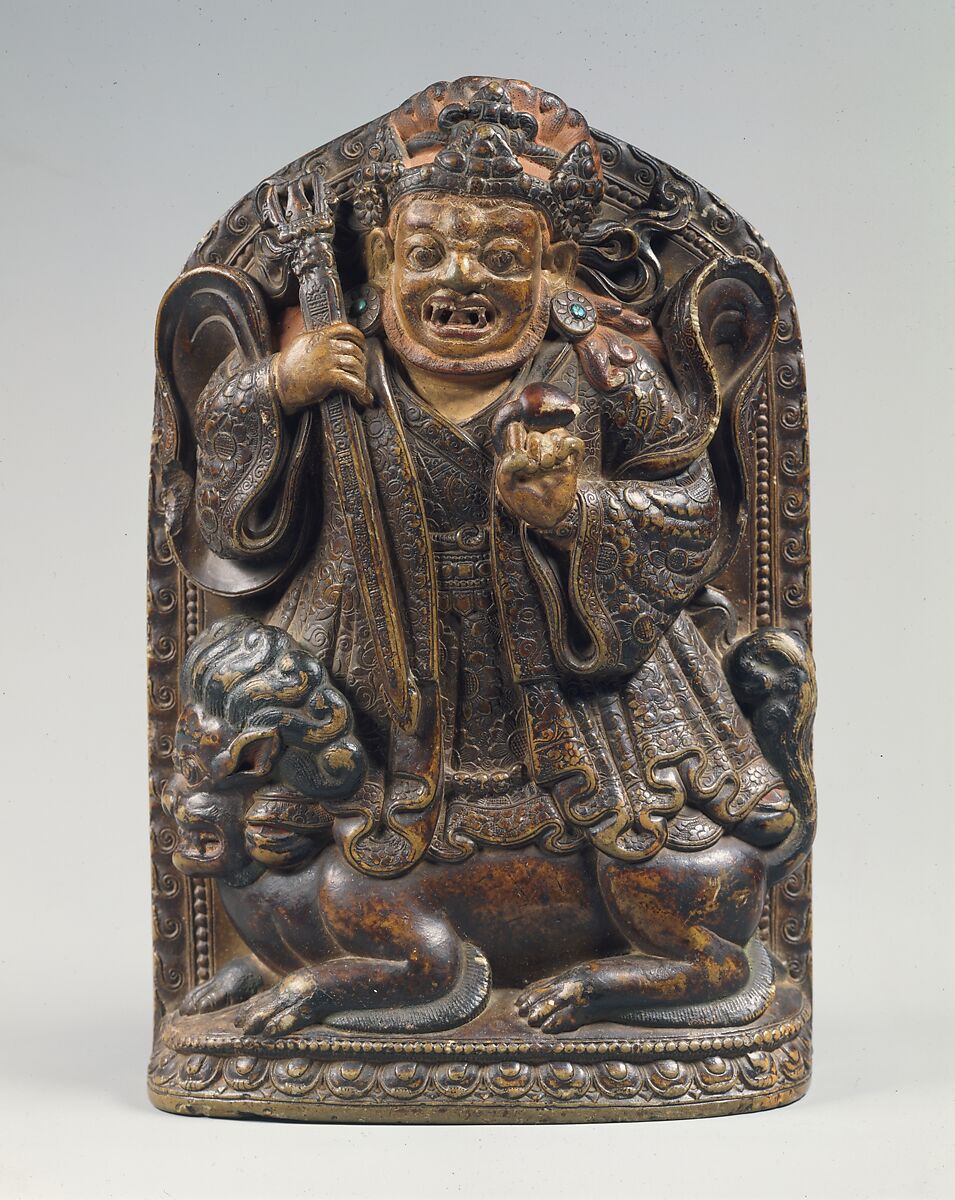 Dharmapala Standing on a Lion, Stone with traces of gold paint, inlaid with turquoise, Tibet 