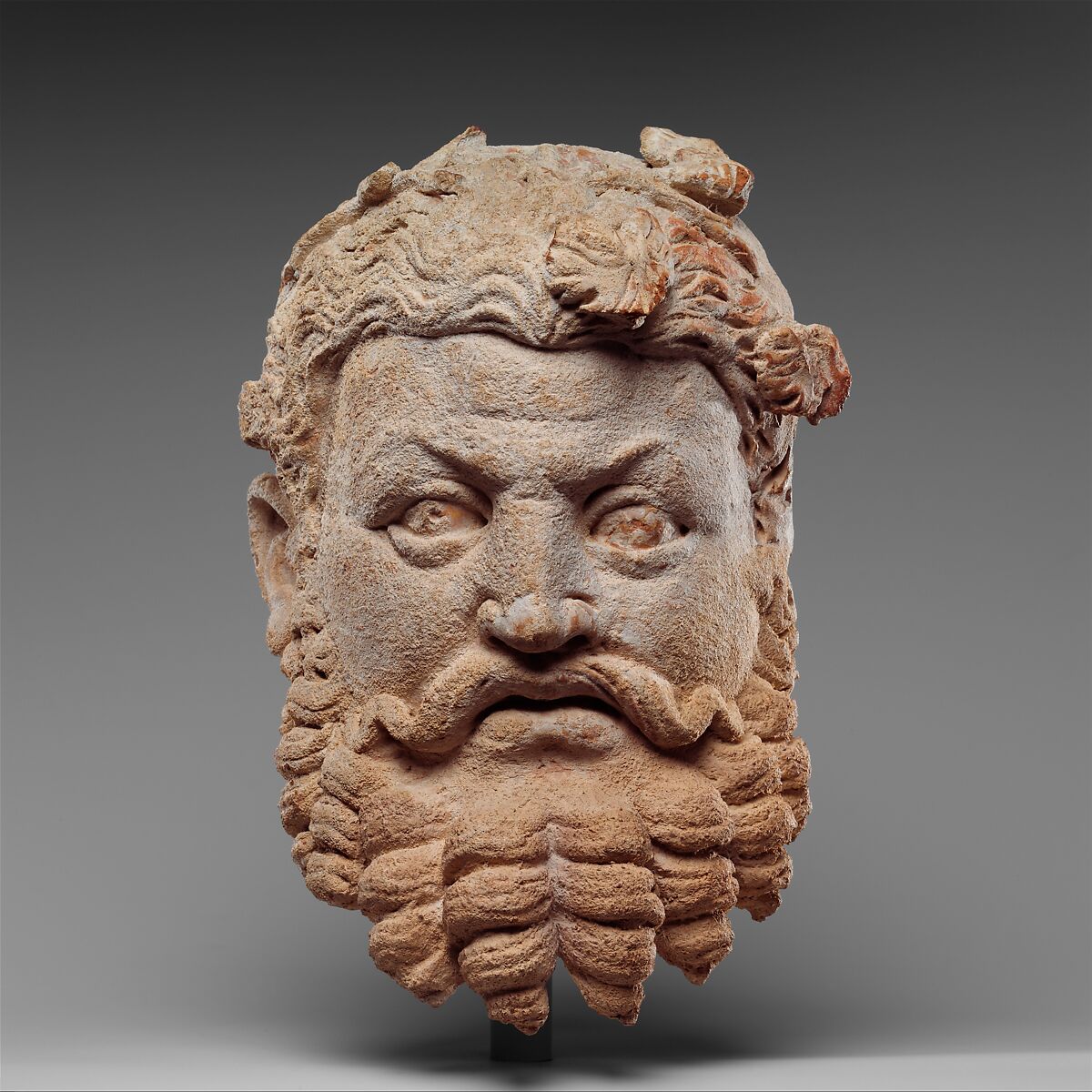 Head of Dionysos (The God of Wine and Divine Intoxication), Terracotta, Pakistan (ancient region of Gandhara) 