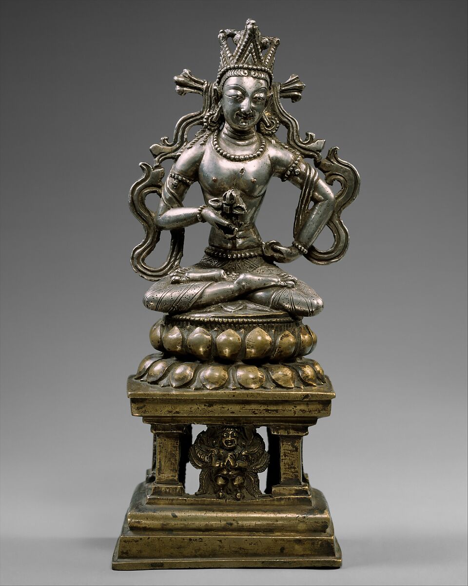 Amoghasiddhi, the Transcendent Buddha of the North, Silver and bronze with copper inlay and traces of gold foil, Western Tibet 