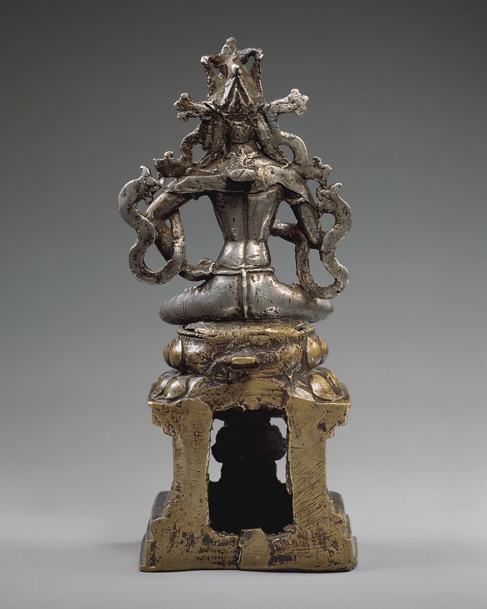 Amoghasiddhi, the Transcendent Buddha of the North, Silver and bronze with copper inlay and traces of gold foil, Western Tibet