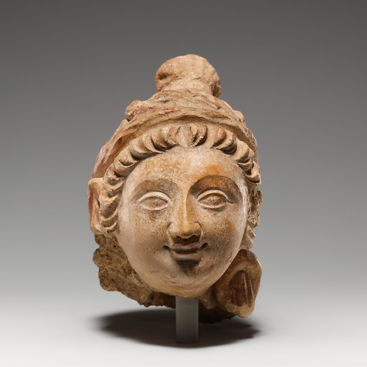 Head of a Female Figure, Stucco with traces of color, Pakistan (ancient region of Gandhara) 