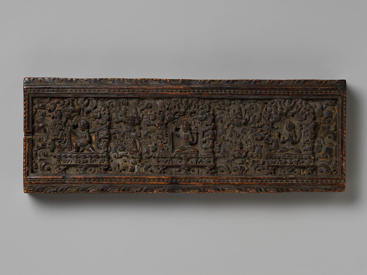 Manuscript Cover with the Bodhisattva Manjushri Flanked by Vajrapani and Avalokiteshvara, Wood with traces of gilding and distemper on inner surface, Tibet