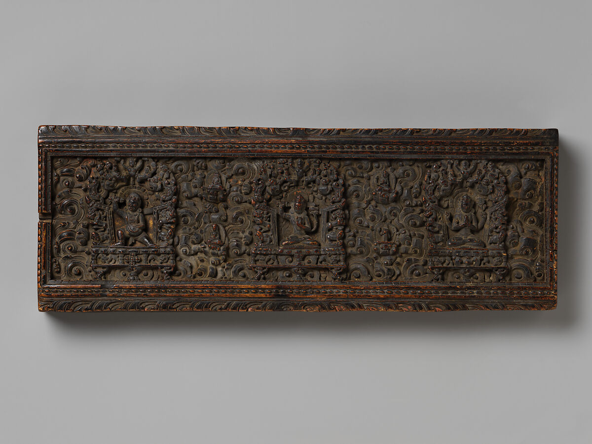 Manuscript Cover with the Bodhisattva Manjushri Flanked by Vajrapani and Avalokiteshvara, Wood with traces of gilding and distemper on inner surface, Tibet 