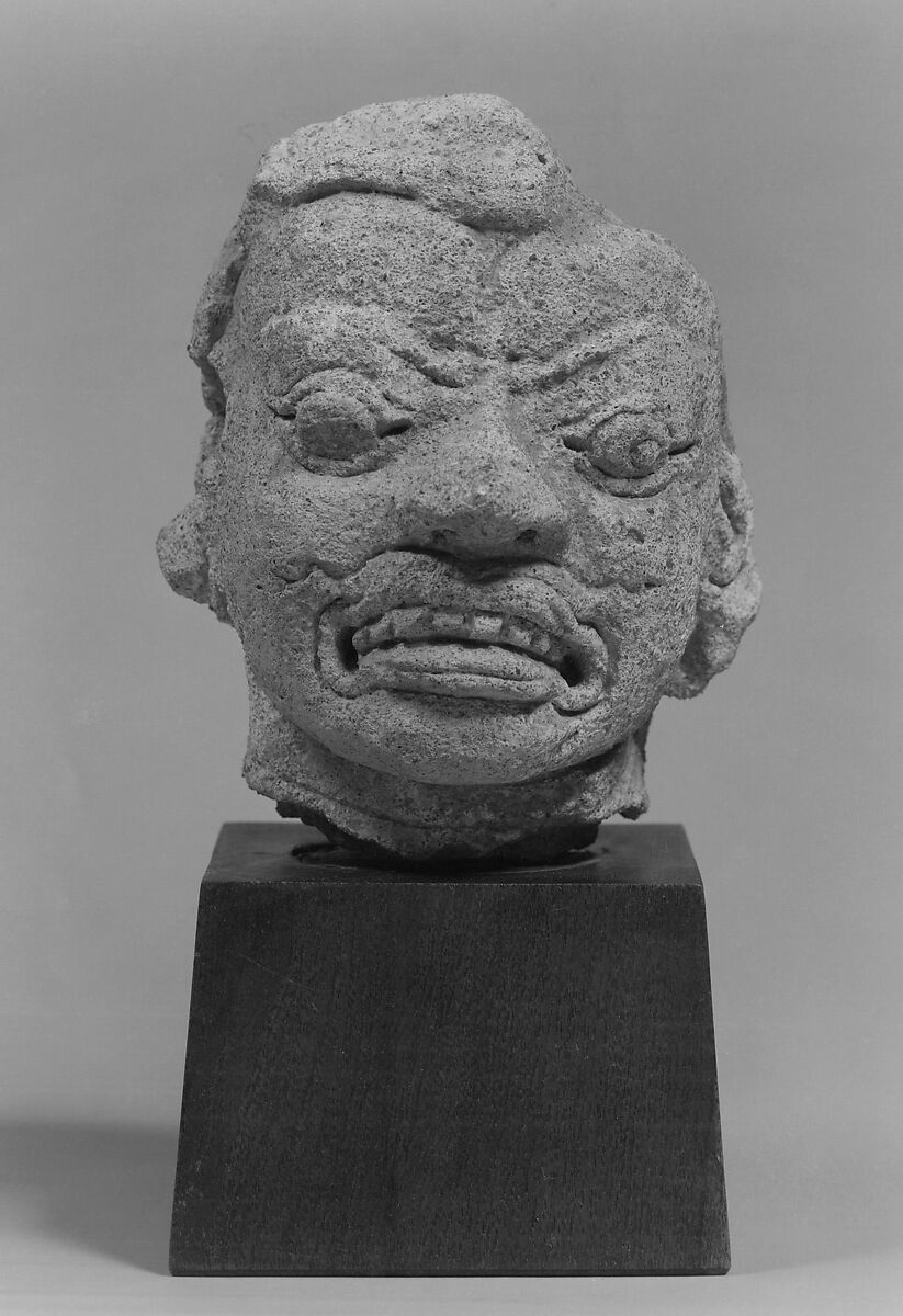 Head of a Grimacing Male Deity, Stucco, Thailand 