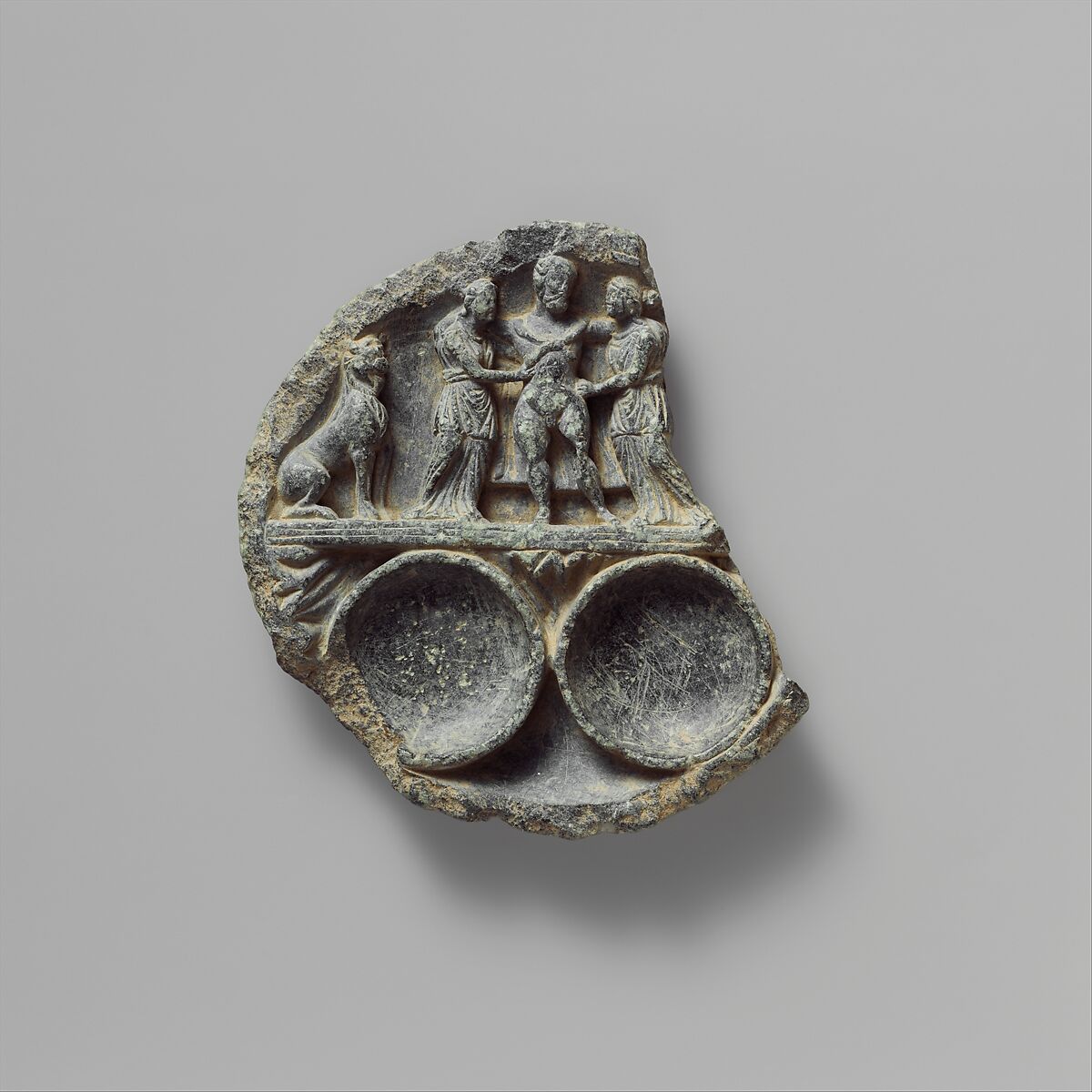 Dish with the Drunken Hercules Supported by Two Women and Flanked by a Lion, Schist, Pakistan (ancient region of Gandhara)