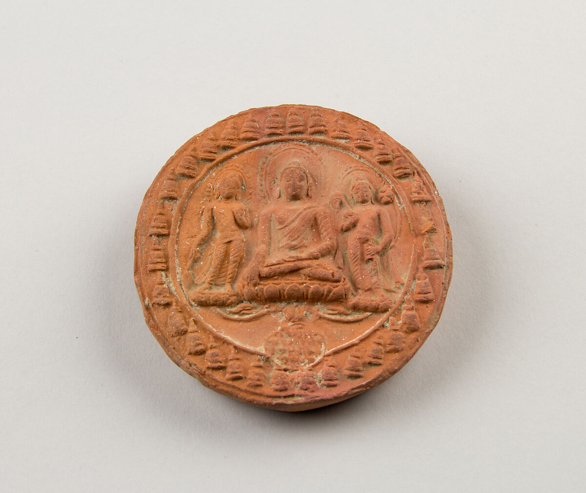 Molded Plaque with Seated Buddha and Attendant Bodhisattvas, Terracotta, India (Bihar) 